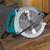 Makita 5402NA 16‑5/16" Circular Saw resting on a beam